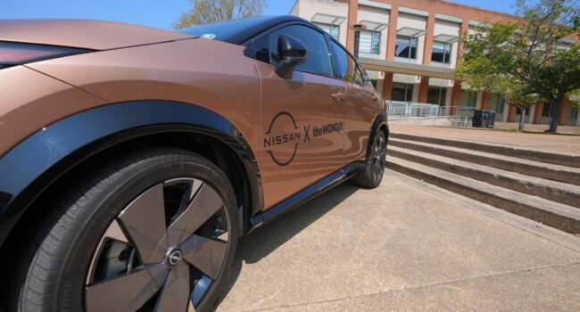 A Nissan car with the Wond'ry logo displayed on Vanderbilt campus