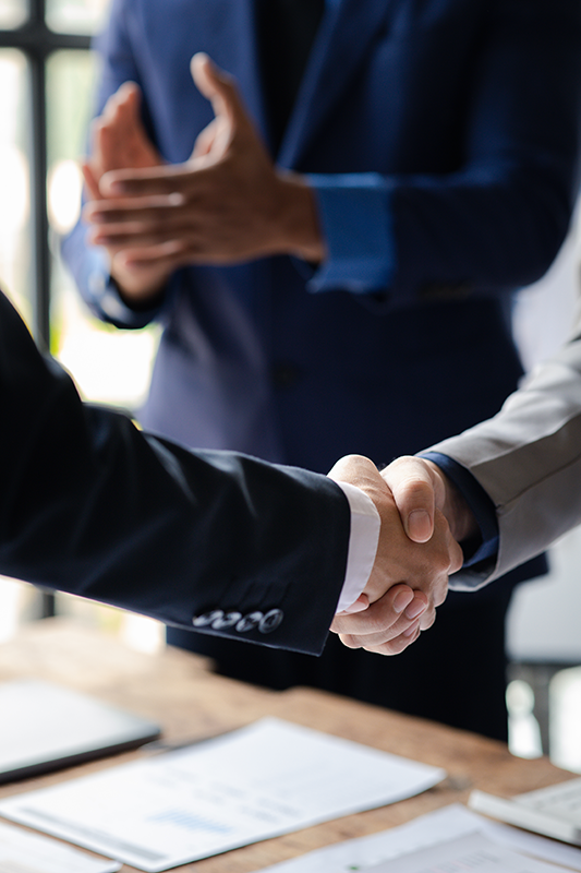 Close-up two business men shaking hands