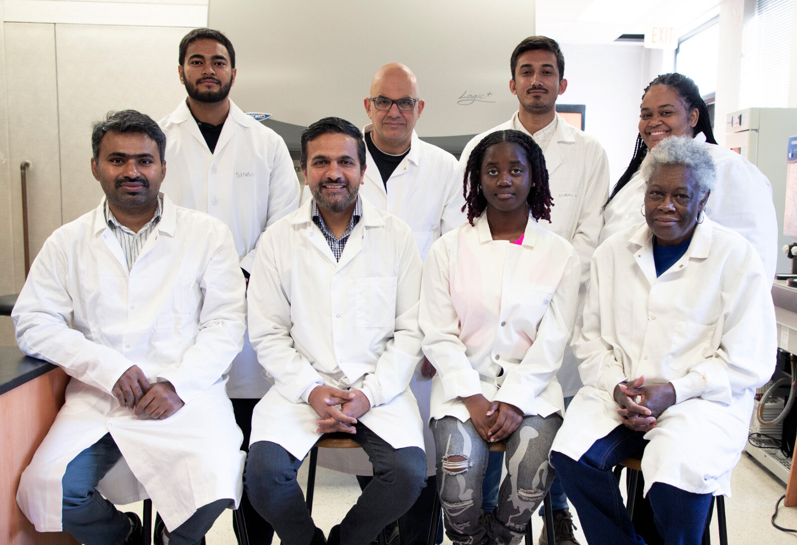 Dr. Patras, seated second from left, poses with his team of scientists at Tennessee State University who are part of the FloUV project.