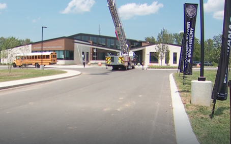 Williamson County’s new Innovation Center, with a school bus and fire truck outside the building.